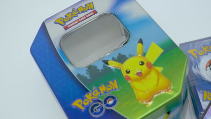 Pokémon Tin Bundle – 100 cartes Pokémon assorties, 1 carte ultra rare et pièce de jeu